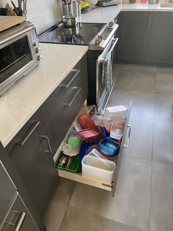 I love these double drawers for tupperware storage. Great lids in